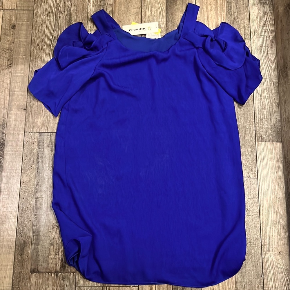 Never worn. Ruffled dress with cold shoulders